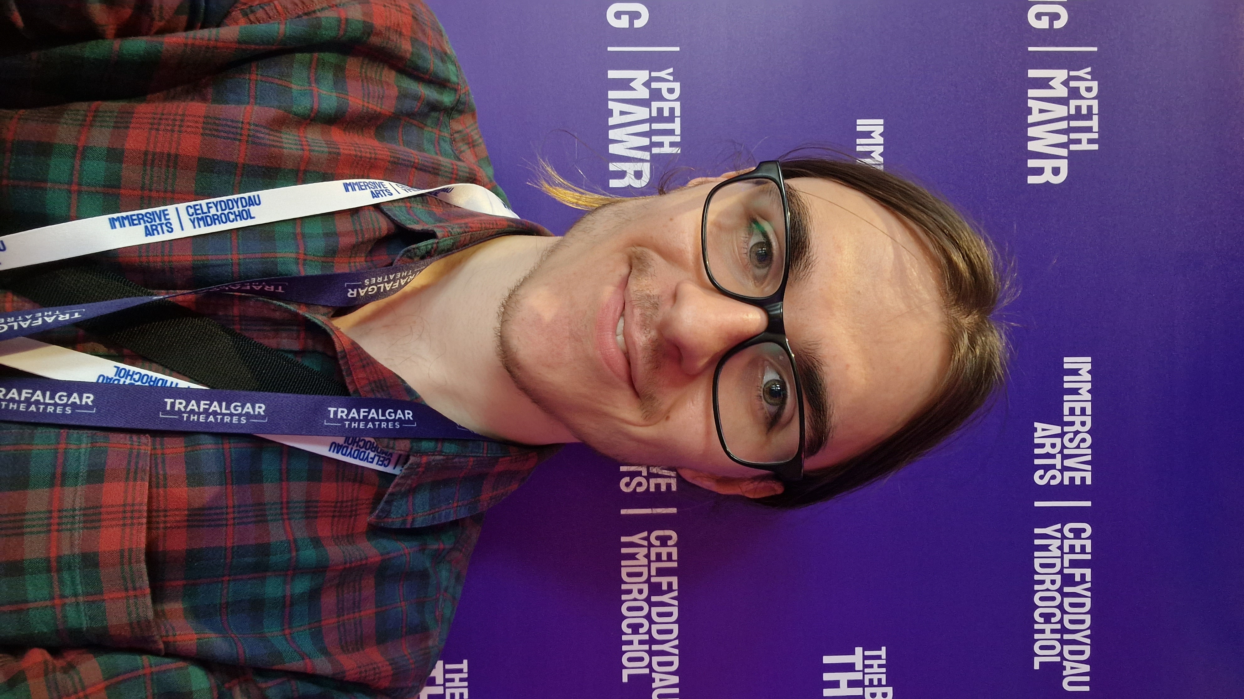 Jack Smedley infront of a banner with The Big Thing 2025's branding